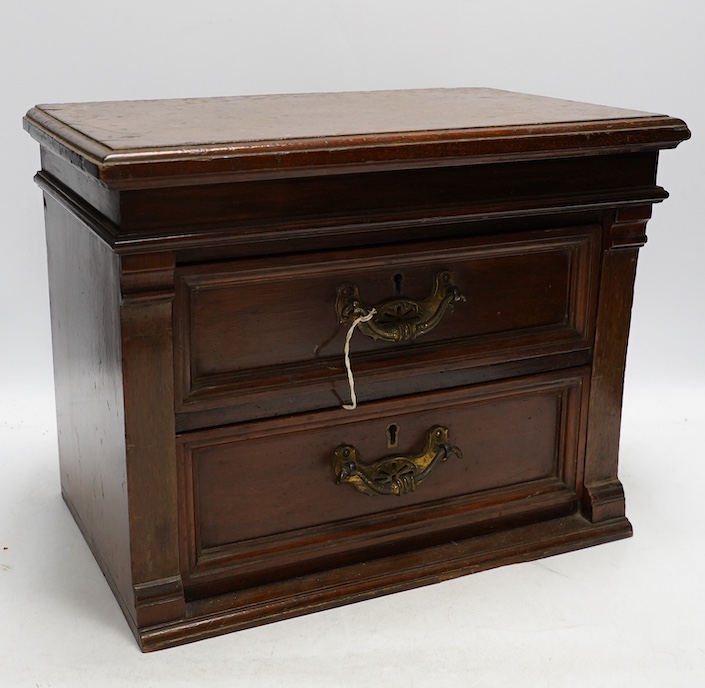 A Victorian mahogany two drawer table top cabinet, 37cm. Condition - fair